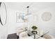 Stylish dining area featuring a glass table, modern chandelier, and decorative wall art at 2201 Huntingdon Chase St, Atlanta, GA 30350
