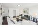 Open living room features modern decor, stylish furniture, and hardwood flooring at 2201 Huntingdon Chase St, Atlanta, GA 30350