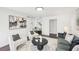 Cozy living room with modern decor, hardwood floors, and open floor plan at 2201 Huntingdon Chase St, Atlanta, GA 30350