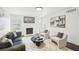 Well-lit living room showcasing modern furniture, minimalist decor, and a cozy fireplace at 2201 Huntingdon Chase St, Atlanta, GA 30350