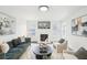 Inviting living room with fireplace, modern furniture, and plenty of natural light at 2201 Huntingdon Chase St, Atlanta, GA 30350