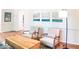 Inviting living room space with hardwood floors, elegant seating, and serene wall art at 2745 Saxon Drive, Duluth, GA 30096