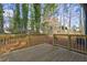 A newly built wooden deck overlooks a grassy backyard with mature trees at 4210 Pepperdine Dr, Decatur, GA 30034