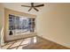 Bright bedroom featuring a large window with natural light and hardwood floors at 4210 Pepperdine Dr, Decatur, GA 30034