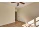 Bedroom boasts neutral paint, ceiling fan, and hardwood flooring at 4210 Pepperdine Dr, Decatur, GA 30034