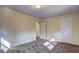 This bedroom features neutral paint, carpet floors, base molding and two doors at 4210 Pepperdine Dr, Decatur, GA 30034
