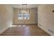 Dining room features hardwood floors and modern chandelier at 4210 Pepperdine Dr, Decatur, GA 30034