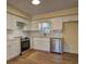 Updated kitchen featuring white cabinets, stainless steel appliances, and modern finishes at 4210 Pepperdine Dr, Decatur, GA 30034