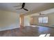 Spacious living room featuring hardwood floors, a ceiling fan, and natural light at 4210 Pepperdine Dr, Decatur, GA 30034