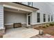 Covered back patio featuring neutral siding, space for seating, and access to the backyard at 1179 Bennett Creek Overlook, Suwanee, GA 30024