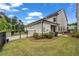Spacious backyard featuring lush green grass, landscaping, and a fenced perimeter at 1179 Bennett Creek Overlook, Suwanee, GA 30024