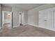 Bedroom with plush carpet and multiple doors leading to other rooms at 1179 Bennett Creek Overlook, Suwanee, GA 30024