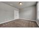 Neutral bedroom with plush carpet, a double closet and natural light at 1179 Bennett Creek Overlook, Suwanee, GA 30024