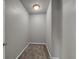 Walk-in closet with neutral carpet and basic lighting at 1179 Bennett Creek Overlook, Suwanee, GA 30024