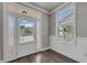Welcoming entryway with decorative glass door and natural light streaming through the window at 1179 Bennett Creek Overlook, Suwanee, GA 30024