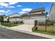 View of modern home with a two-car garage and fenced front yard at 1179 Bennett Creek Overlook, Suwanee, GA 30024
