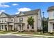 Two-story brick home featuring manicured landscaping and a covered front porch, exuding curb appeal at 1179 Bennett Creek Overlook, Suwanee, GA 30024
