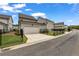 View of modern home with a two-car garage and fenced front yard at 1179 Bennett Creek Overlook, Suwanee, GA 30024