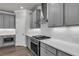 Close-up of kitchen featuring sleek countertops, stainless steel appliances, and stylish cabinetry at 1179 Bennett Creek Overlook, Suwanee, GA 30024