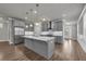 Modern kitchen with a large island, stainless steel appliances, and an open layout at 1179 Bennett Creek Overlook, Suwanee, GA 30024