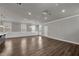 Expansive living room with hardwood floors, and large windows for ample natural light at 1179 Bennett Creek Overlook, Suwanee, GA 30024