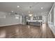 Spacious living room with hardwood floors, recessed lighting, and an open floor plan at 1179 Bennett Creek Overlook, Suwanee, GA 30024