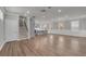 Bright living room featuring hardwood floors, recessed lighting, and staircase access at 1179 Bennett Creek Overlook, Suwanee, GA 30024