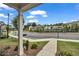 Scenic neighborhood street view featuring sidewalks, lush landscaping, and a community pool at 1179 Bennett Creek Overlook, Suwanee, GA 30024