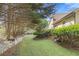 Grassy backyard features lush landscaping and plenty of space to enjoy at 2520 Hartford Dr, Ellenwood, GA 30294