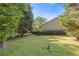 Expansive backyard features a well-maintained lawn and mature trees at 2520 Hartford Dr, Ellenwood, GA 30294