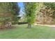 Lush backyard with a well-maintained lawn and mature trees at 2520 Hartford Dr, Ellenwood, GA 30294