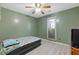 Cozy bedroom featuring light gray flooring and a ceiling fan at 2520 Hartford Dr, Ellenwood, GA 30294