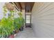 Welcoming front porch with hanging plants and cozy welcome mat at 2520 Hartford Dr, Ellenwood, GA 30294