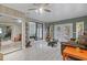Bright living room with wood look tile flooring, and a view of a stone fireplace at 2520 Hartford Dr, Ellenwood, GA 30294