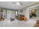 Bright living room with wood look tile flooring, and a view of a stone fireplace at 2520 Hartford Dr, Ellenwood, GA 30294