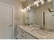 Bright bathroom with double sinks, marble countertops, and modern lighting at 3364 Old Concord Se Rd, Smyrna, GA 30082