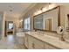 Bright bathroom featuring marble countertops, double sinks, a soaking tub, and a glass shower at 3364 Old Concord Se Rd, Smyrna, GA 30082