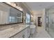 Luxurious bathroom with marble countertops, a freestanding tub, and a glass-enclosed shower at 3364 Old Concord Se Rd, Smyrna, GA 30082