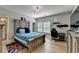 Comfortable bedroom with a decorative headboard, carpet, and natural light from a window at 3364 Old Concord Se Rd, Smyrna, GA 30082