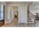 Bright entryway featuring hardwood floors, staircase, and modern lighting at 3364 Old Concord Se Rd, Smyrna, GA 30082
