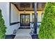 Inviting front entrance with double doors, lanterns, and charming exterior details at 3364 Old Concord Se Rd, Smyrna, GA 30082