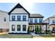 Stunning two-story home with black trim, well-manicured lawn, and inviting entrance at 3364 Old Concord Se Rd, Smyrna, GA 30082