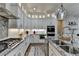 Gourmet kitchen with stainless steel appliances, a granite island, and custom cabinetry at 3364 Old Concord Se Rd, Smyrna, GA 30082