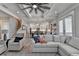 Cozy living room with a comfortable sofa, stylish chairs, and a modern ceiling fan at 3364 Old Concord Se Rd, Smyrna, GA 30082