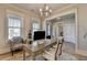 Inviting home office with bright windows, stylish furniture, and elegant lighting at 3364 Old Concord Se Rd, Smyrna, GA 30082