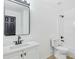 Bright bathroom featuring a white vanity, black fixtures, and a shower-tub combo, providing a clean and modern look at 3487 Creekview Dr, Rex, GA 30273