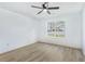 Bright bedroom with wood-style flooring and a large window showcasing natural light at 3487 Creekview Dr, Rex, GA 30273