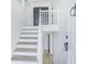 Bright foyer showcasing a staircase with wood steps, white risers and railings, enhancing the home's entry at 3487 Creekview Dr, Rex, GA 30273