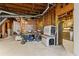 Unfinished basement offering open space with exposed beams and potential for storage or expansion at 403 S River Farm Dr, Alpharetta, GA 30022
