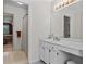 Bathroom with double sinks, cabinets and view into adjacent bathroom and bedroom at 403 S River Farm Dr, Alpharetta, GA 30022